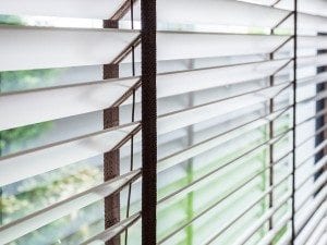 Close-up of a window with timber blinds
