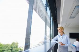 Young business woman in bright modern office